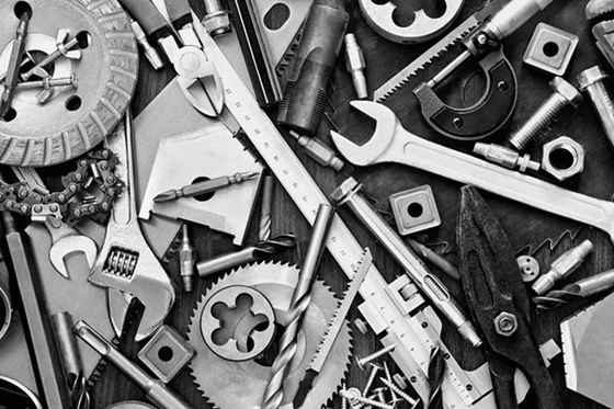 Metal tools and parts in black and white
